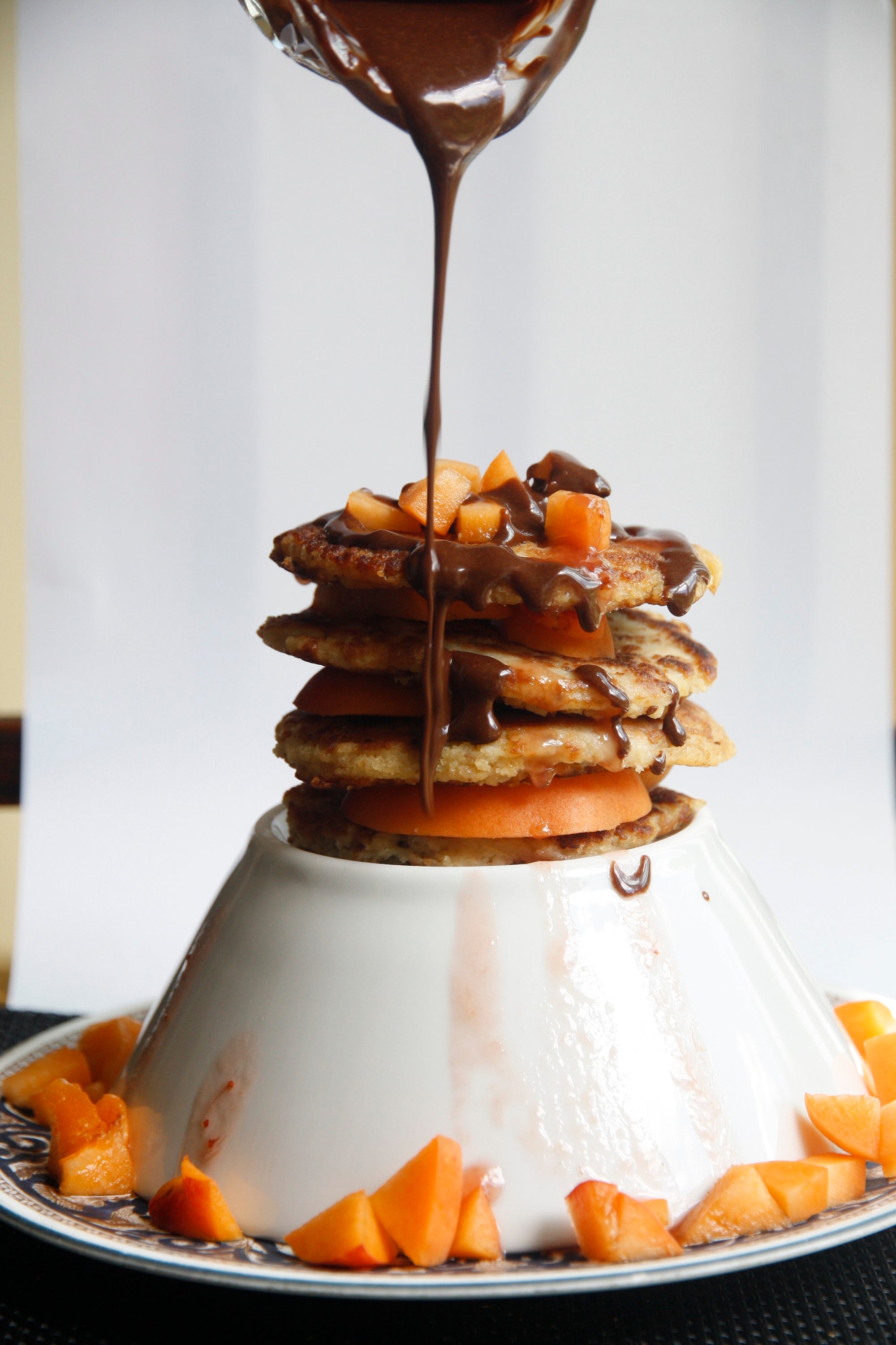 pancakes poured by melted chocolate